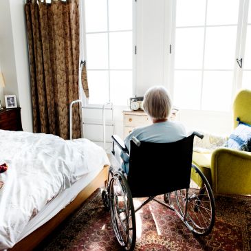 Elderly resident in a bright, comfortable room
