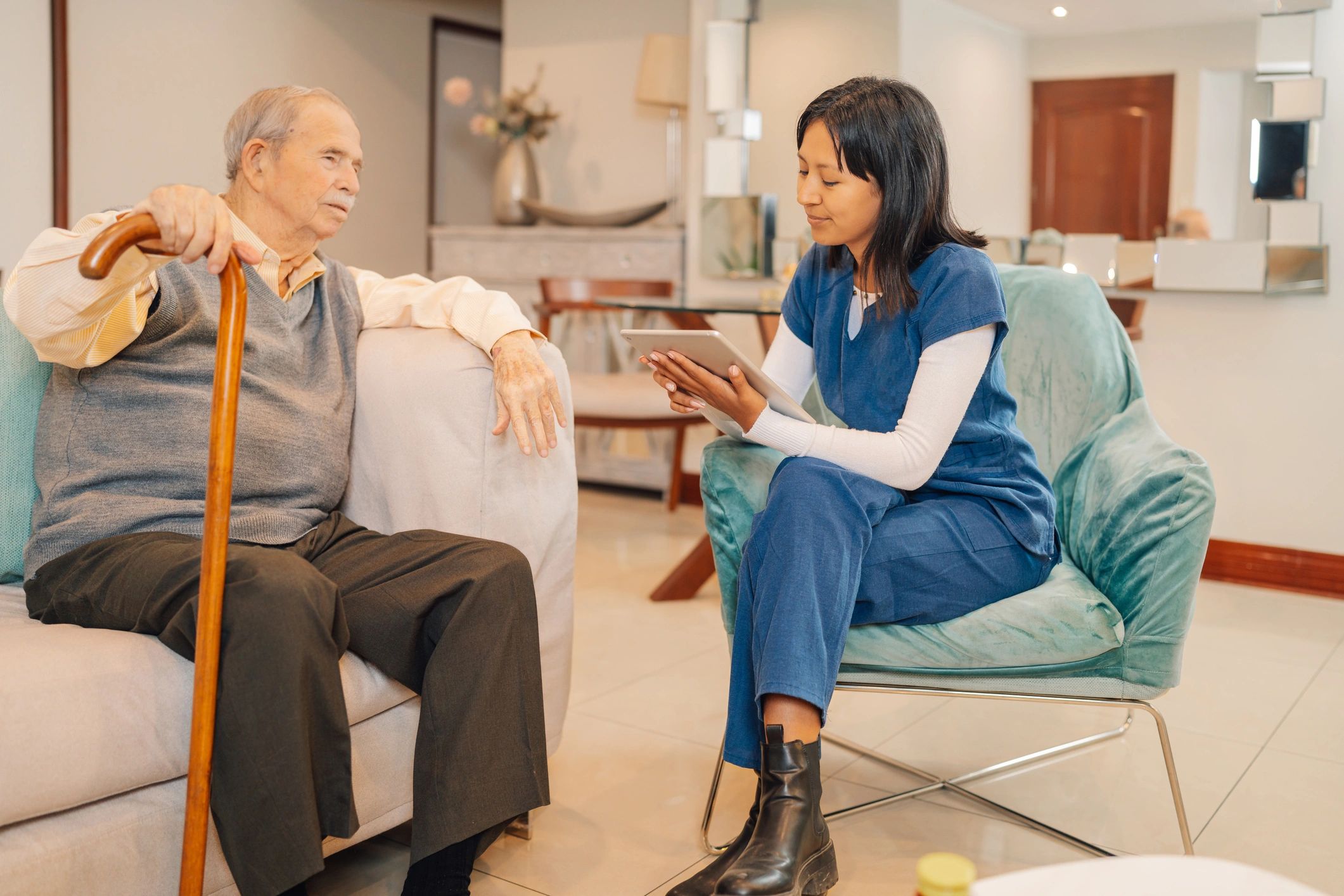 Healthcare professional visiting elderly patient